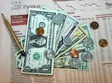 Доллар потерял весь недельный рост, рухнув сразу на 30 копеек